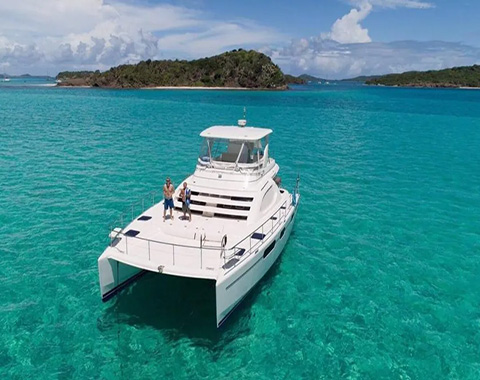 A white catamaran on the ocean