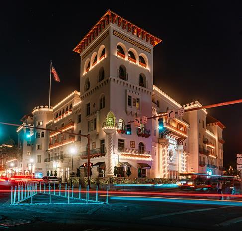 St. George Street in St. Augustine, FL illuminated by city lights at night.