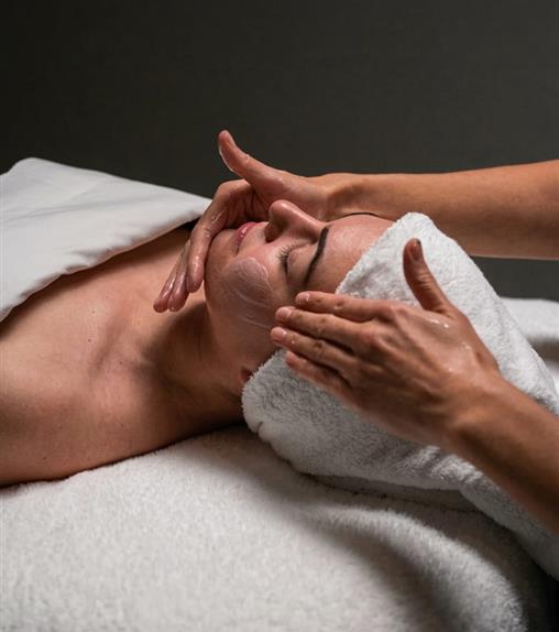 Woman getting a facial massage