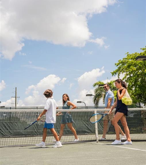 Family on a tennis court