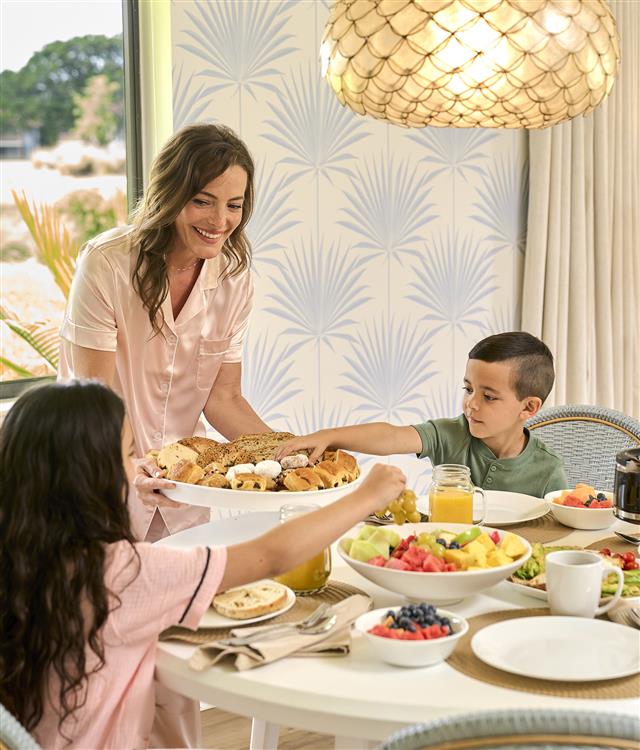 Family having a meal in a suite