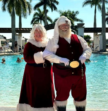 mr and mrs claus by the pool