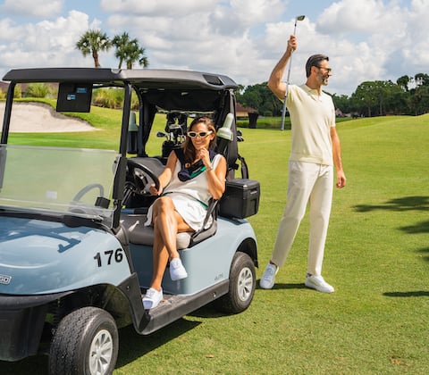 Couple golfing at PGA National Resort