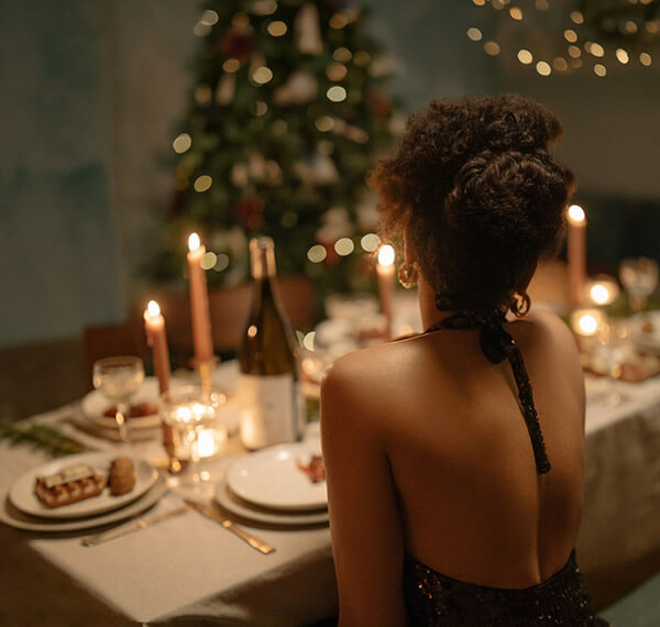 Woman at a candlelit dinner