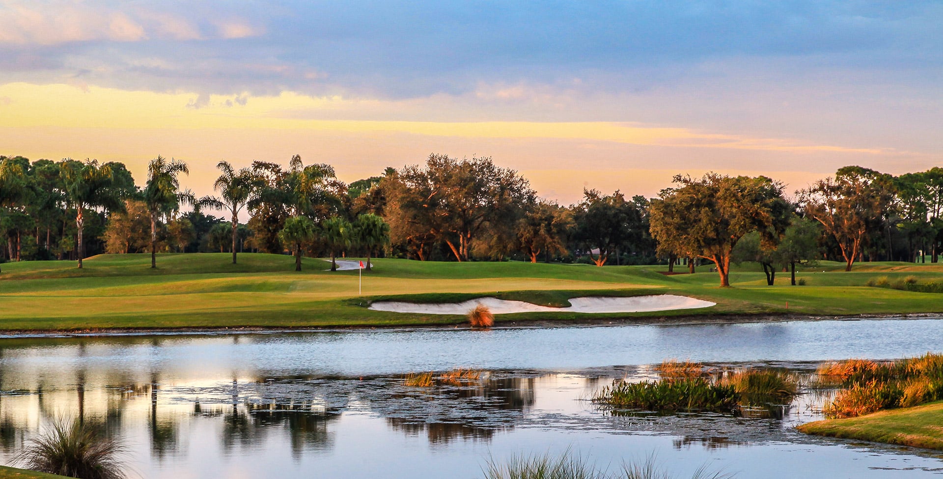 A championship golf hole at sunset